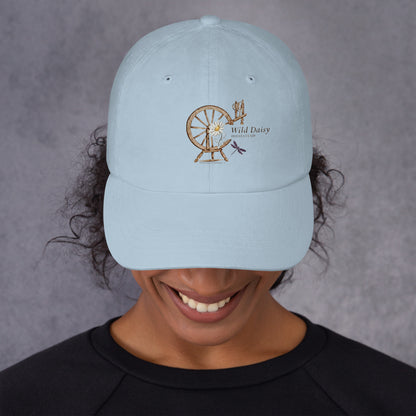 Whimsical Spinning Wheel and Dragonfly Graphic Dad Hat in Light Blue.
