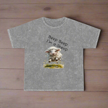 Beep Beep I'm a sheep printed over an adorable little white amb that is running through a field of flowers.  Mineral washed for vintage look. Heavy weight 100 % cotton.  For adults, teens and younger. 